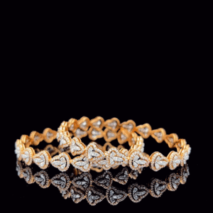 Gold diamond bangles with heart-leaf motif reflecting luxury design